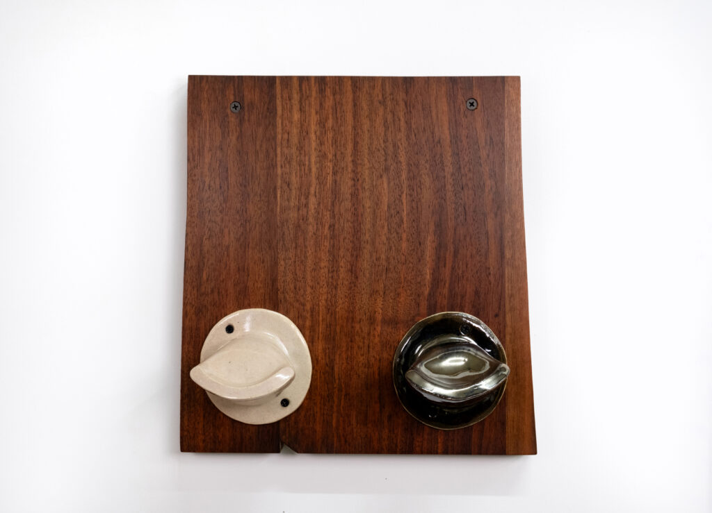 Untitled 2023 stoneware, glaze, wood, screws 11 ½ x 11 x 4 in